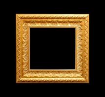 Golden antique frame isolated on black background photo