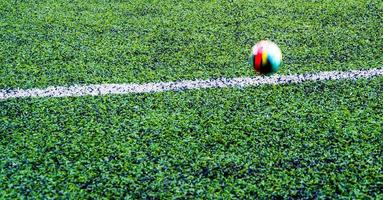 ball in the artificial turf of the school photo