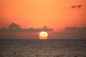 Omega sunrise in the sea photo