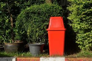 Outdoor red garbage bin photo