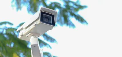 CCTV camera on  natural blur background 24 hour security equipment