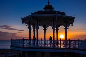 BRIGHTON, EAST SUSSEX, UK, 2018.  View of the sunset from a bandstand photo