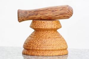 Pestle and mortar made of coconut tree photo