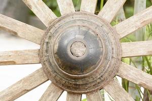 The wood wheel of a cart or buckboard. photo