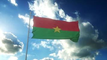 Flag of Burkina Faso waving at wind against beautiful blue sky. 3d illustration photo