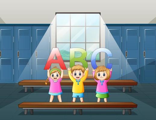 Happy student holding the letter ABC in locker room