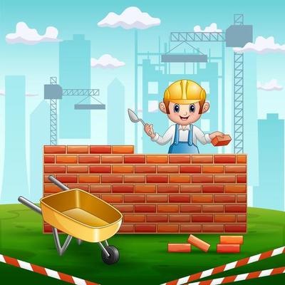 A man builder with a trowel in his hand builds a brick wall