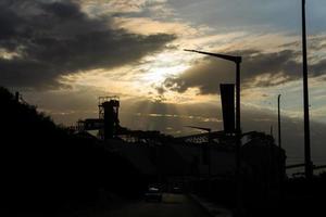 Rays of sunlight over a silo photo