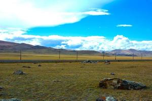 Bright steppe landscape with a road photo