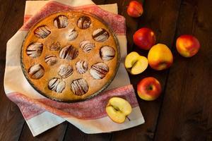 Apple pie on dark background photo