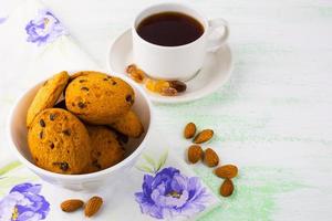 Sweet cookies,  tea cup and almond photo