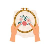 Female hands holding embroidery hoop with floral embroidery isolated on white background. Modern colorful vector hand drawn illustration