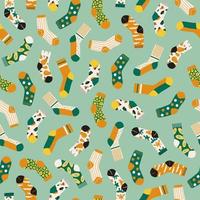 Trendy seamless pattern of colored bright socks isolated on green background. Socks with different abstract patterns. Vector cartoon illustration