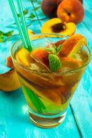Refreshing drink with peaches photo