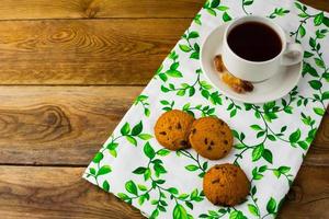Tea cup and biscuits, top view photo