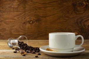 Coffee cup on the wooden background photo