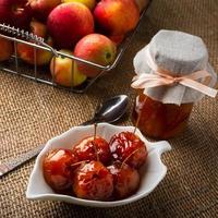 Cherry apples covered in syrup photo