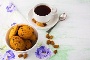 Cookies, almond and cup of tea photo
