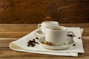 Coffee cups served on the linen napkin photo