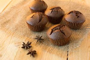 Chocolate muffins on sackcloth photo