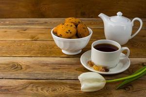 Cup of tea and porcelain teapot photo