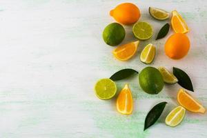 Lime and Lemon on light green background photo