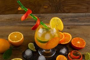 Cool citrus cocktail on wooden table photo