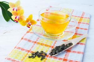 Cup of tea on checkered napkin photo