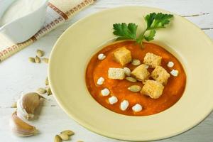 Pumpkin soup with garlic croutons photo