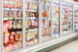 Frozen food section in supermarket blurred background photo
