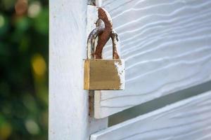 Closeup wood gate with lock photo