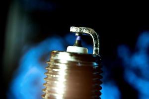 macro photo of a spark plug in close-up on a dark background