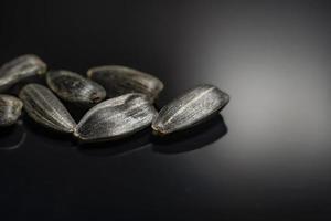 sunflower seeds on a black background macrophoto. photo