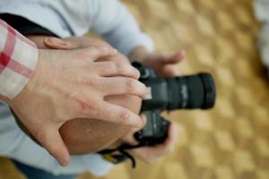 Prohibition of photography. Hand on the photographer's head photo