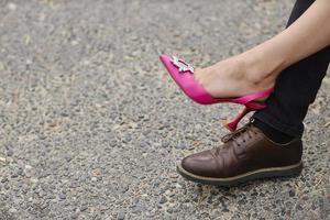 Women's and men's feet in shoes close-up photo