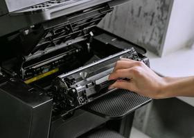 replacing the cartridge in the laser printer photo