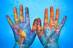 the map of the world on hands photo
