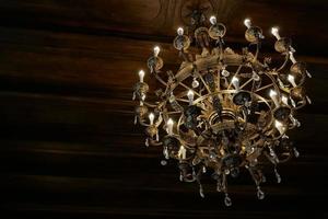 old luxury gold chandelier on the ceiling photo