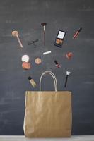Levitation photo of make up set out from shopping bag