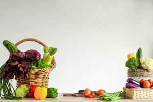 Various of fresh colorful vegetables on kitchen table photo