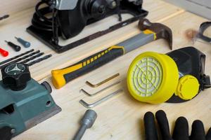Creative flat lay composition of various carpenter tools on wooden table photo