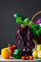 Various of fresh colorful vegetables on wooden table photo