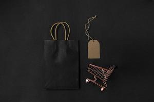 Flat lay composition of shopping accessories for shopaholic online shopping and black friday sale promotion photo