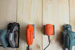 Flat lay of various carpenter tools on wood with copy space photo