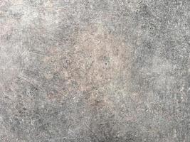 The cement flap surface has scratches, black and white stains, traces caused by plastering to create an artistic pattern photo