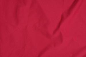 textura de jersey deportivo rojo, fondo de camisa foto