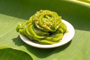 Rhombic dessert is a Thai dessert that looks like green on banana leaves. photo