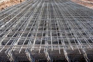 Steel grating is prepared to make cement floors for construction photo