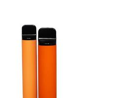 two disposable e-cigarettes. The concept of modern smoking, vaping and nicotine. Top view photo