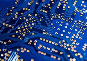 blurred background of the circuit Board in blue macro photo. photo